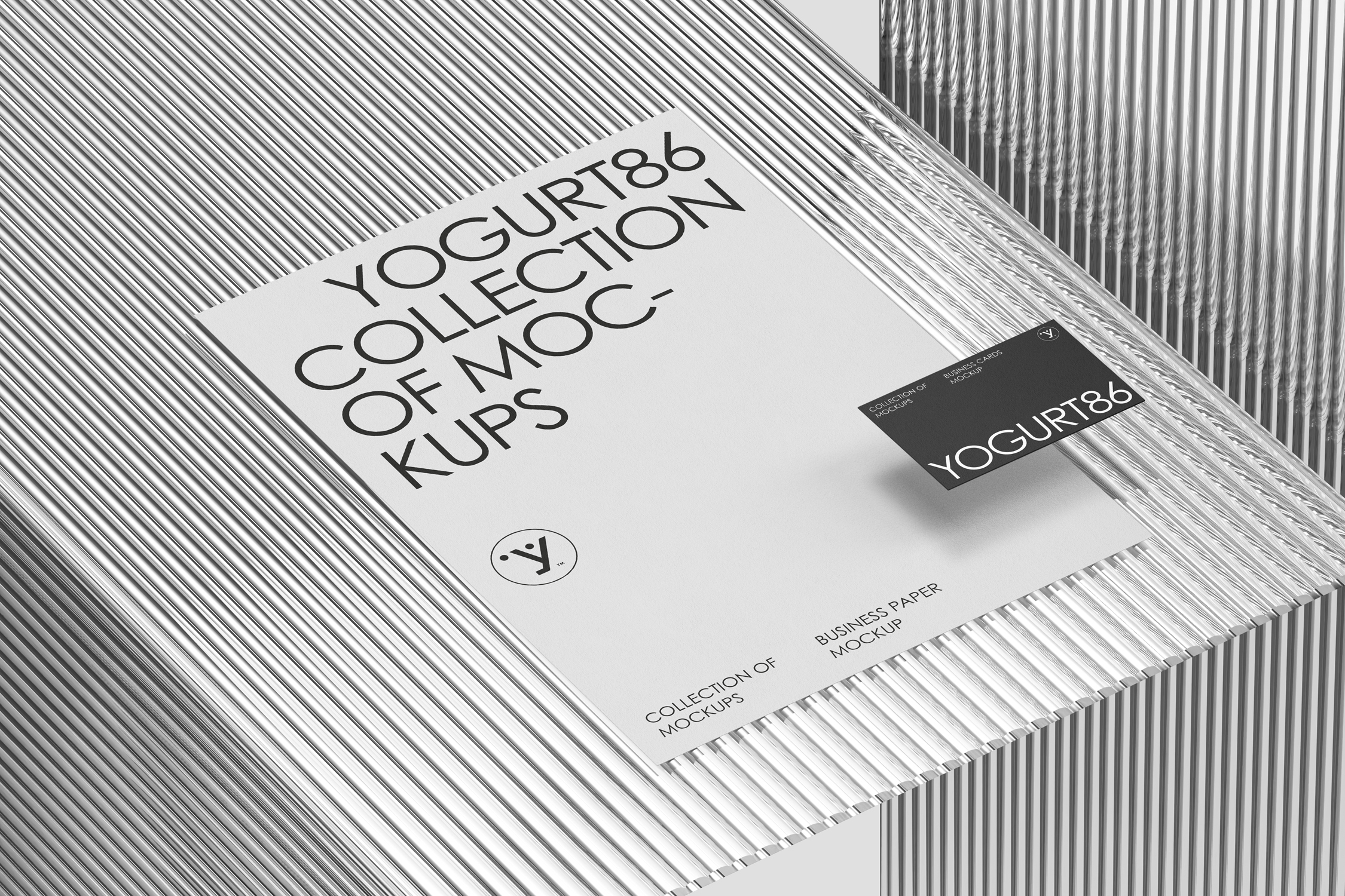 This stationery mockup features a refined business card paired with an A4 letterhead, both placed on a grooved glass surface that gives the whole setup a modern and airy look. It's a great way to showcase a full brand identity with a touch of elegance. What makes this mockup stand out is its high resolution and image quality, every element is sharp, crisp, and perfectly lit. The scene has been carefully crafted, down to the tiniest details, to deliver a realistic and well-balanced composition. Ideal for designers who want to present their work with clarity, depth, and a professional finish.
